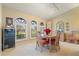 Bright dining room with arched windows and view to outside at 3749 Bordeaux Dr, Punta Gorda, FL 33950