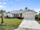 Exterior of a single-story home with a light-colored facade at 3749 Bordeaux Dr, Punta Gorda, FL 33950