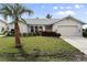 Single-story home with attached garage and manicured lawn at 3749 Bordeaux Dr, Punta Gorda, FL 33950