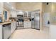 Well-equipped kitchen with white cabinets and granite countertops at 3749 Bordeaux Dr, Punta Gorda, FL 33950