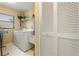 Well-lit laundry room with washer, dryer, and storage at 3749 Bordeaux Dr, Punta Gorda, FL 33950