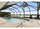 Relaxing kidney-shaped pool with screened enclosure at 3749 Bordeaux Dr, Punta Gorda, FL 33950