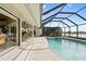 Inviting pool with screened enclosure and golf course view at 3749 Bordeaux Dr, Punta Gorda, FL 33950