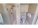 Updated bathroom with a walk-in shower, toilet and white cabinets at 3830 Bal Harbor Blvd # 5, Punta Gorda, FL 33950