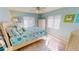 Bedroom with a coastal theme, featuring a queen bed and calming decor at 3830 Bal Harbor Blvd # 5, Punta Gorda, FL 33950