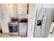 Bright laundry room with washer, dryer and extra storage at 3830 Bal Harbor Blvd # 5, Punta Gorda, FL 33950