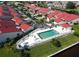 Community pool with surrounding patio and landscaping at 3830 Bal Harbor Blvd # 5, Punta Gorda, FL 33950