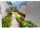 Landscaped walkway with lush greenery and flowers at 3830 Bal Harbor Blvd # 5, Punta Gorda, FL 33950