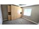 Carpeted bedroom with a built-in wardrobe and natural lighting at 3830 Bal Harbor Blvd # 5, Punta Gorda, FL 33950