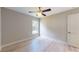 Bright bedroom featuring light flooring and a ceiling fan at 4393 Antioch St, North Port, FL 34288