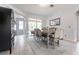 Bright dining room featuring a farmhouse table and access to a patio at 4398 Appleton Ter, North Port, FL 34286