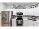 Modern kitchen with stainless steel appliances and white cabinets at 4398 Appleton Ter, North Port, FL 34286