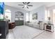 Bright living room with comfy seating and built-in shelving at 4398 Appleton Ter, North Port, FL 34286