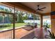 Enclosed patio with ceiling fan and view at 4398 Appleton Ter, North Port, FL 34286