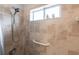 Shower stall with beige tile and a grab bar at 4398 Appleton Ter, North Port, FL 34286