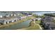 Beautiful aerial view of waterfront properties featuring a golf course and lush landscapes at 43996 Boardwalk Loop # 1411, Punta Gorda, FL 33982