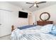 Serene bedroom with natural light, a ceiling fan, and a cozy, inviting atmosphere at 43996 Boardwalk Loop # 1411, Punta Gorda, FL 33982