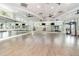 Spacious fitness studio with mirrored walls, ballet bar, and a wood floor, ideal for group classes or personal training at 43996 Boardwalk Loop # 1411, Punta Gorda, FL 33982