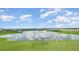 A serene lake and green putting range provide stunning views in this beautiful community at 43996 Boardwalk Loop # 1411, Punta Gorda, FL 33982