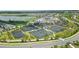 Aerial view of tennis courts, golf course, and community buildings at 43996 Boardwalk Loop # 1411, Punta Gorda, FL 33982