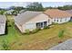 House showcasing solar panels, screened porch, and yard at 483 Winwood Ct, Port Charlotte, FL 33954