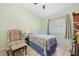 Cozy bedroom with a single bed and a comfortable armchair at 483 Winwood Ct, Port Charlotte, FL 33954