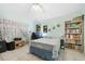 Bright bedroom with built-in shelves and a double bed at 483 Winwood Ct, Port Charlotte, FL 33954