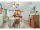 Charming dining area featuring a wooden table, chairs, and built-in hutch at 483 Winwood Ct, Port Charlotte, FL 33954