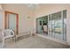 Private patio with sliding glass doors leading to interior at 483 Winwood Ct, Port Charlotte, FL 33954