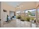 Relaxing screened porch overlooking a grassy backyard at 483 Winwood Ct, Port Charlotte, FL 33954