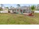 Large backyard with storage shed and screened pool area at 5273 Crestline Ter, Port Charlotte, FL 33981