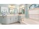 Bathroom with soaking tub and double vanity at 5273 Crestline Ter, Port Charlotte, FL 33981