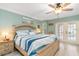 Main bedroom with king bed and pool view at 5273 Crestline Ter, Port Charlotte, FL 33981