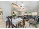 Bright dining room with a table for six and view of the kitchen at 5273 Crestline Ter, Port Charlotte, FL 33981