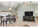 Dining area with a chandelier, wood floors, and adjacent kitchen at 5273 Crestline Ter, Port Charlotte, FL 33981