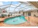 Enjoy this refreshing screened-in pool and patio area at 5273 Crestline Ter, Port Charlotte, FL 33981