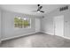 Bright living room with tile flooring and ceiling fan at 5452 Montego Ln, Port Charlotte, FL 33981