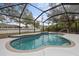 Relaxing screened-in pool with ample space for lounging at 5452 Montego Ln, Port Charlotte, FL 33981