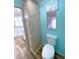 Bathroom with toilet and built-in storage at 6642 Acacia Ct, North Port, FL 34287