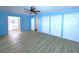 Main bedroom with ample closet space and wood-look flooring at 6642 Acacia Ct, North Port, FL 34287