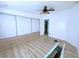 Bedroom with built-in storage and laminate flooring at 6642 Acacia Ct, North Port, FL 34287