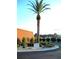 Landscaped entrance to the community with palm trees and signage at 6642 Acacia Ct, North Port, FL 34287