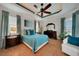 Comfortable bedroom with teal bedding and ensuite bathroom access at 720 Bimini Ln, Punta Gorda, FL 33950