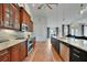 View of kitchen with stainless steel appliances and custom cabinetry at 720 Bimini Ln, Punta Gorda, FL 33950