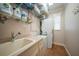 Laundry room with washer, dryer, and utility sink at 720 Bimini Ln, Punta Gorda, FL 33950