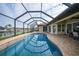 Expansive pool and screened enclosure overlooking the canal at 720 Bimini Ln, Punta Gorda, FL 33950