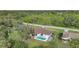 An aerial view shows a house with a pool in the backyard at 813 Thornton Nw Ave, Port Charlotte, FL 33948