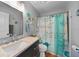 Bathroom with shower, vanity and nautical decor at 813 Thornton Nw Ave, Port Charlotte, FL 33948