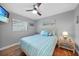 Bedroom with a queen bed, TV, and ceiling fan at 813 Thornton Nw Ave, Port Charlotte, FL 33948