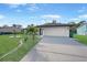 Newly paved driveway and updated garage door add to this home's exterior at 813 Thornton Nw Ave, Port Charlotte, FL 33948